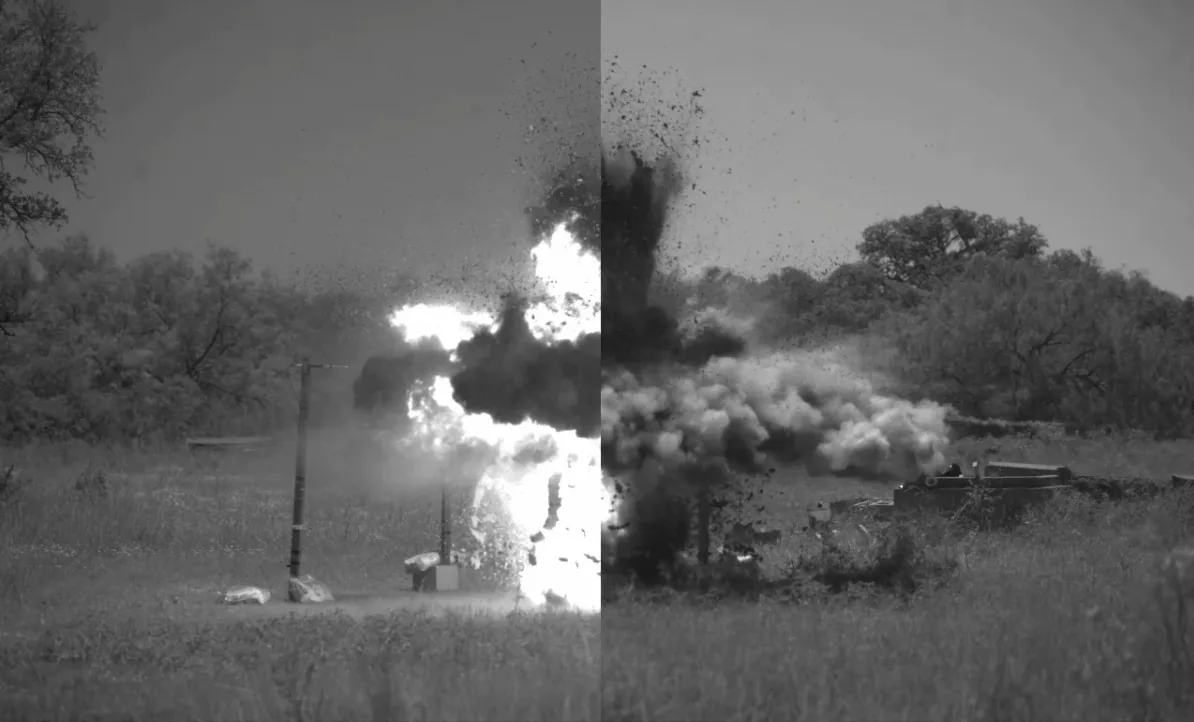 Split-screen high-speed frame 5 milliseconds after a 600 gram C-4 detonation. The unmitigated left side shows a large bright fireball; the mitigated right side shows dark smoke with much less visible flame.