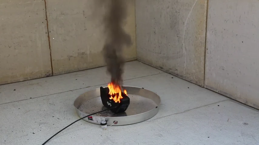 A battery pack burning in a steel pan during the Lion-X test recording.